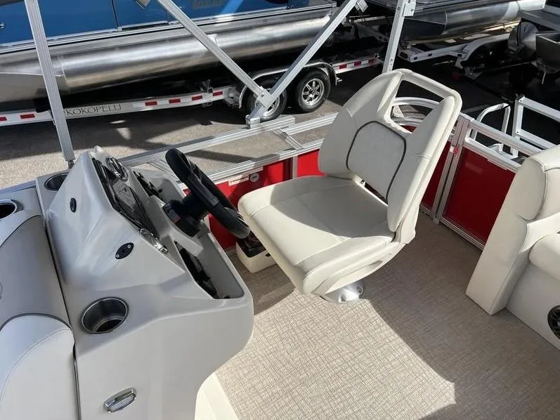 Slide: The Image of 2024 Avalon Cruise or Fish boat interior with steering console and comfortable seating. - 15