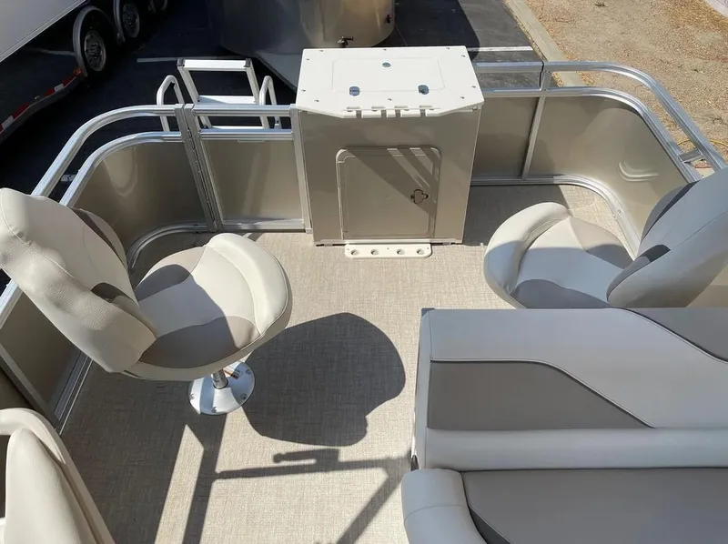 Slide: The Image of 2024 Avalon Cruise or Fish boat interior with seating and storage area. - 18