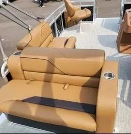 Slide: The Image of 2024 Avalon Cruise or Fish boat with tan leather seating and cup holders. - 2