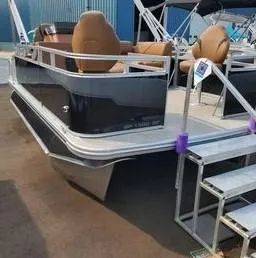 Slide: The Image of 2024 Avalon Cruise or Fish pontoon boat with brown seating and metal steps. - 5