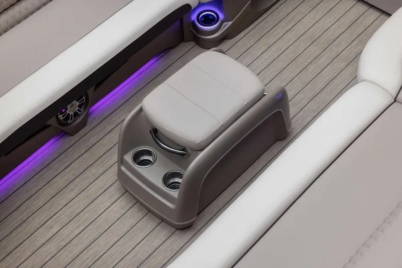 Slide: The Image of 2024 Avalon Excalibur LTD Elite Windshield interior with cup holders and ambient lighting. - 14