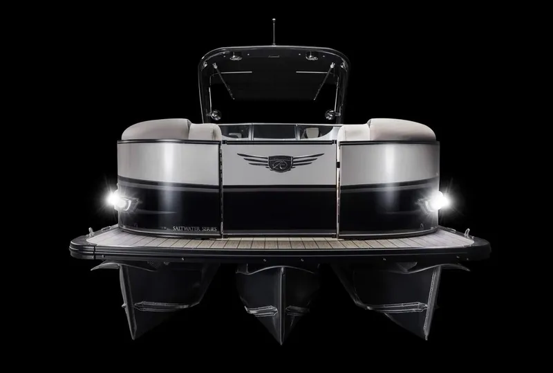 Slide: The Image of 2024 Avalon Excalibur LTD Elite Windshield boat, front view, illuminated, black background. - 16