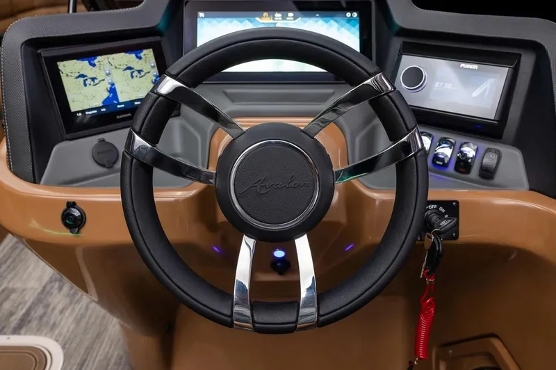Slide: The Image of 2024 Avalon Excalibur LTD Elite Windshield dashboard with steering wheel and navigation screens. - 21