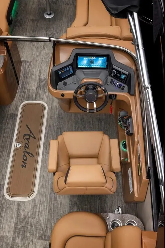 Slide: The Image of 2024 Avalon Excalibur LTD Elite Windshield boat interior with luxurious seating and modern dashboard. - 31