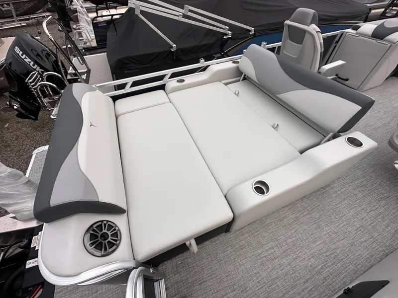 Slide: The Image of 2025 Tahoe Pontoon LTZ Versatile Rear Lounger with gray seating and cup holders. - 3