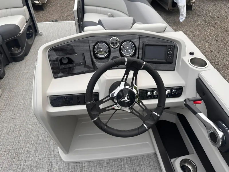 Slide: The Image of 2025 Tahoe Pontoon LTZ Versatile Rear Lounger dashboard with steering wheel and controls. - 9