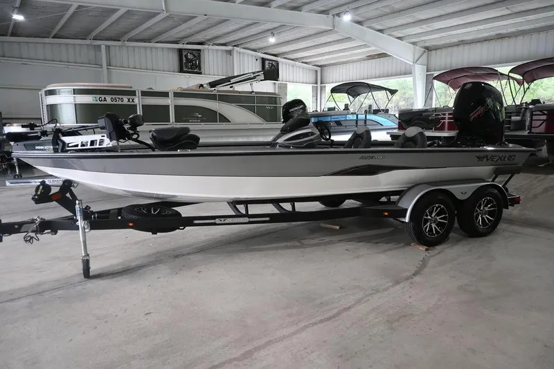 Slide: The Image of 2024 Vexus AVX2080 boat on trailer in indoor showroom. - 0