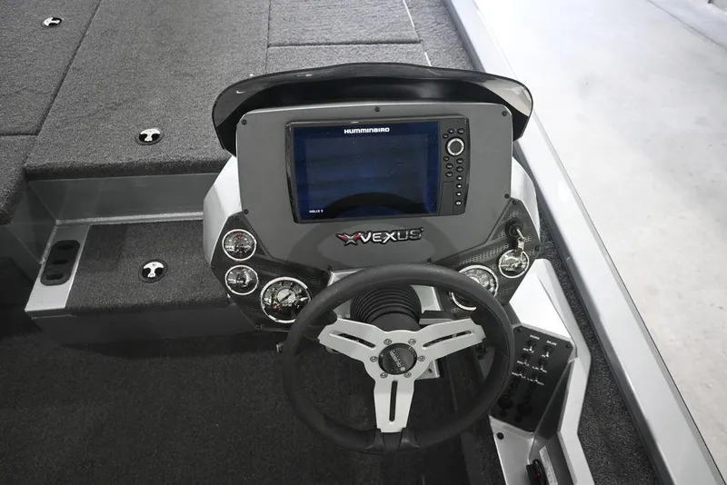 Slide: The Image of 2024 Vexus AVX2080 boat dashboard with steering wheel and electronic display. - 4