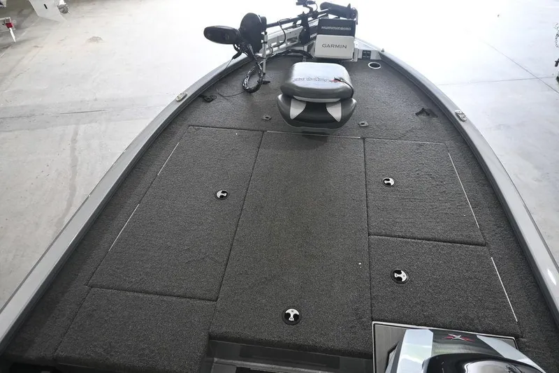 Slide: The Image of 2024 Vexus AVX2080 boat deck with carpeted surface and fishing equipment. - 5