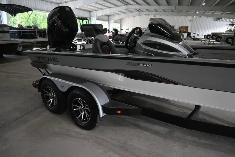 Slide: The Image of 2024 Vexus AVX2080 boat in showroom, featuring sleek design and modern features. - 7