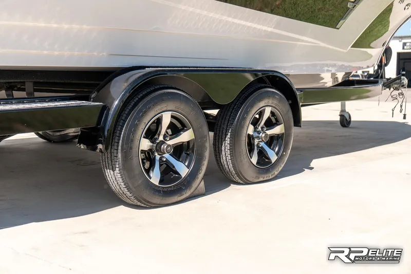 Slide: The Image of Trailer wheels of a 2014 Nautique Super Air Nautique 230 boat. - 10