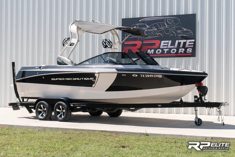 Slide: The Image of 2014 Nautique Super Air Nautique 230 boat on trailer at RP Elite Motors. - 2