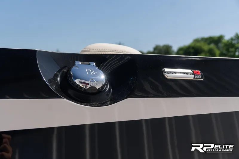 Slide: The Image of 2014 Nautique Super Air Nautique 230 fuel cap and emblem detail. - 23