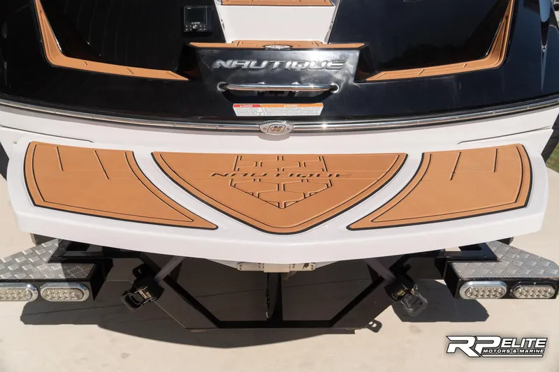 Slide: The Image of 2014 Nautique Super Air Nautique 230 boat stern with custom deck and logo detailing. - 32