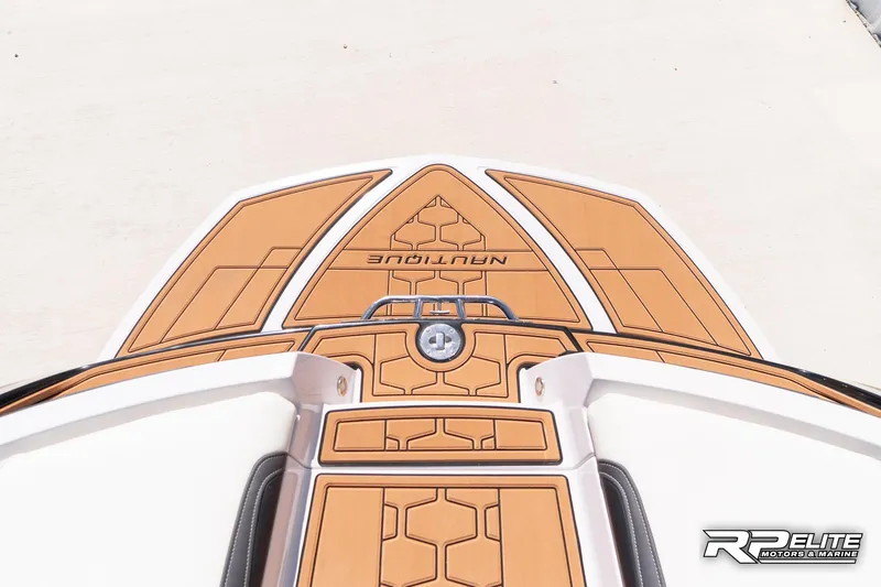 Slide: The Image of 2014 Nautique Super Air Nautique 230 boat deck with tan and white design. - 35