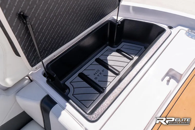 Slide: The Image of 2014 Nautique Super Air Nautique 230 storage compartment with "No Step" warning. - 37