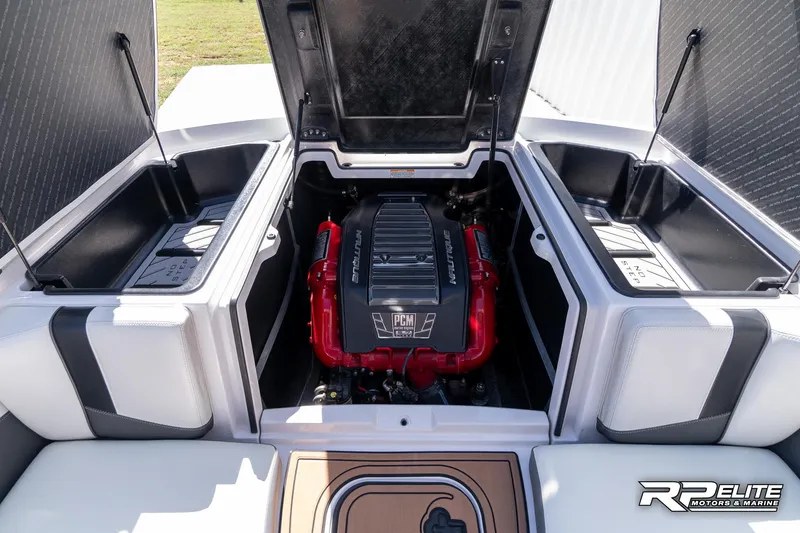 Slide: The Image of 2014 Nautique Super Air Nautique 230 engine compartment with open hatches. - 40