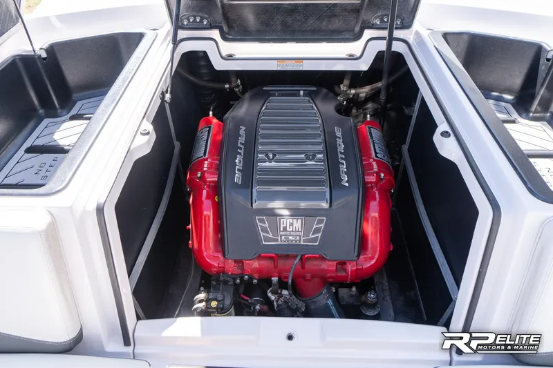 Slide: The Image of 2014 Nautique Super Air Nautique 230 engine compartment with PCM engine, red accents. - 41