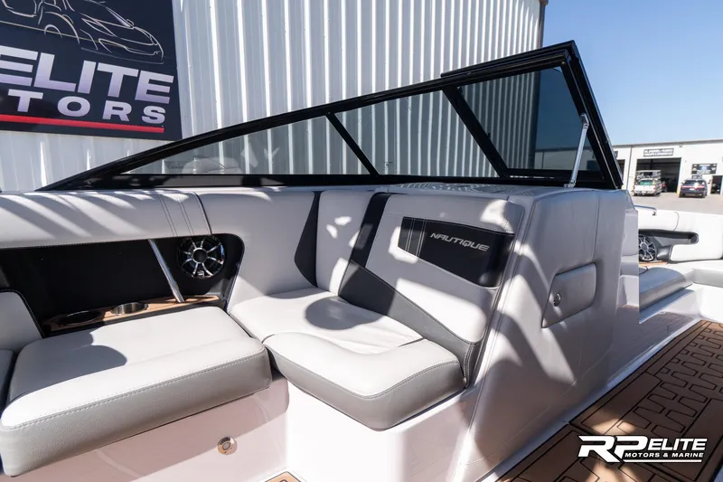 Slide: The Image of 2014 Nautique Super Air Nautique 230 boat interior with sleek seating and modern design. - 45