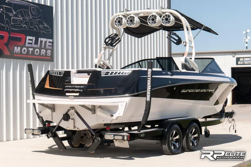 Slide: The Image of 2014 Nautique Super Air Nautique 230 boat on trailer at RP Elite Motors. - 8