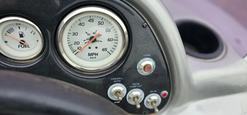 Slide: The Image of Dashboard of 2014 Tracker PG V16 SC boat with speedometer and fuel gauge. - 10