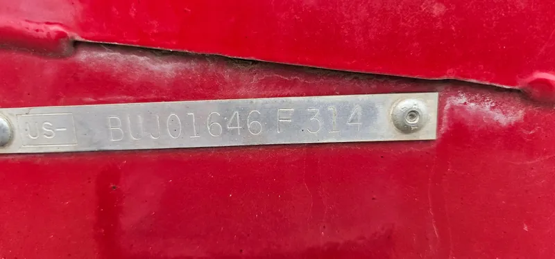Slide: The Image of Metallic identification plate on red Tracker PG V16 SC, 2014 model. - 12