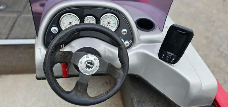 Slide: The Image of Steering console of 2014 Tracker PG V16 SC boat with gauges and fish finder. - 7