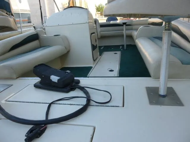 Slide: The Image of Interior of a 2000 SeaArk Sunstar 21 boat with seating and equipment. - 16