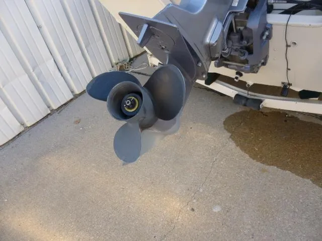 Slide: The Image of Propeller of a 2000 SeaArk Sunstar 21 boat on concrete surface. - 21