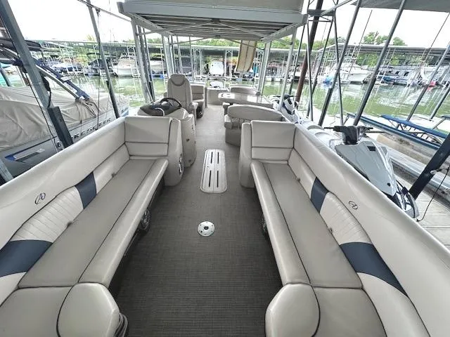 Slide: The Image of 2016 Tahoe Pontoon Vista Funship Entertainer, spacious seating, docked at marina. - 14