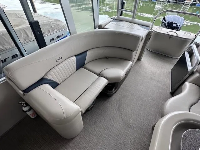 Slide: The Image of 2016 Tahoe Pontoon Vista Funship Entertainer interior with plush seating and modern design. - 18