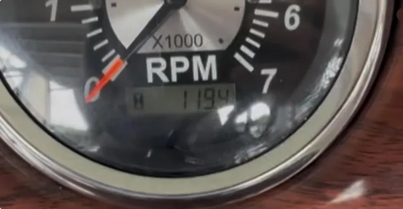Slide: The Image of Close-up of a 2016 Tahoe Pontoon Vista Funship Entertainer RPM gauge showing 1194 RPM. - 30