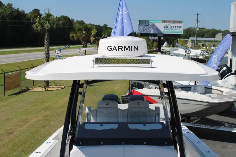Slide: The Image of 2023 Fountain 34 CC boat with Garmin equipment, displayed outdoors. - 11