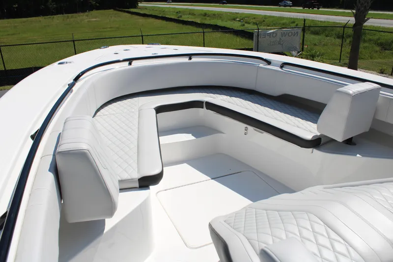Slide: The Image of 2023 Fountain 34 CC boat with luxurious white seating and quilted upholstery. - 14