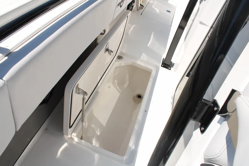 Slide: The Image of 2023 Fountain 34 CC boat interior storage compartment, open and empty. - 25