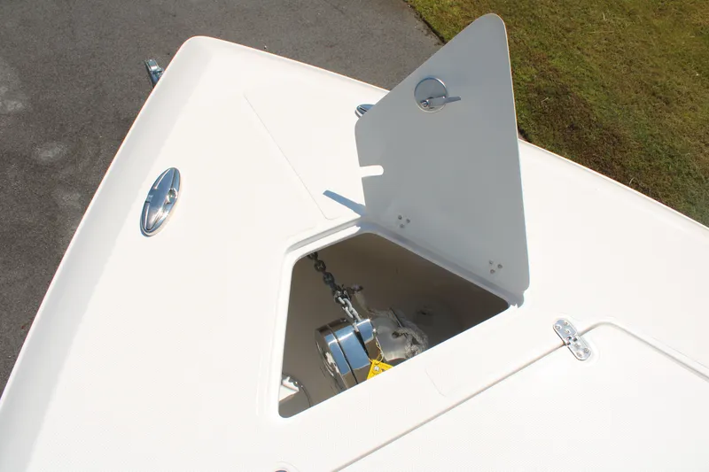 Slide: The Image of 2023 Fountain 34 CC boat anchor compartment with open hatch on deck. - 29