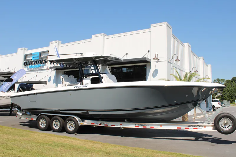Slide: The Image of 2023 Fountain 34 CC boat on trailer outside dealership. - 3