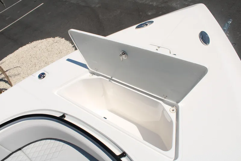 Slide: The Image of 2023 Fountain 34 CC boat with open storage compartment on deck. - 30