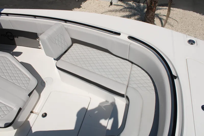 Slide: The Image of 2023 Fountain 34 CC boat interior with cushioned seating and diamond stitching. - 31
