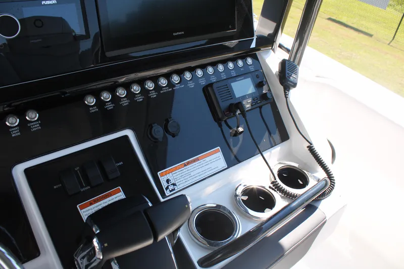 Slide: The Image of Control panel of 2023 Fountain 34 CC boat with navigation and communication equipment. - 36