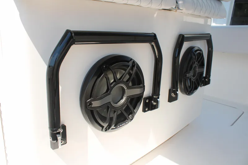 Slide: The Image of 2023 Fountain 34 CC boat speakers with protective black bars. - 41