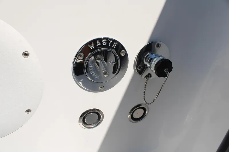 Slide: The Image of 2023 Fountain 34 CC boat waste disposal and plug detail. - 42