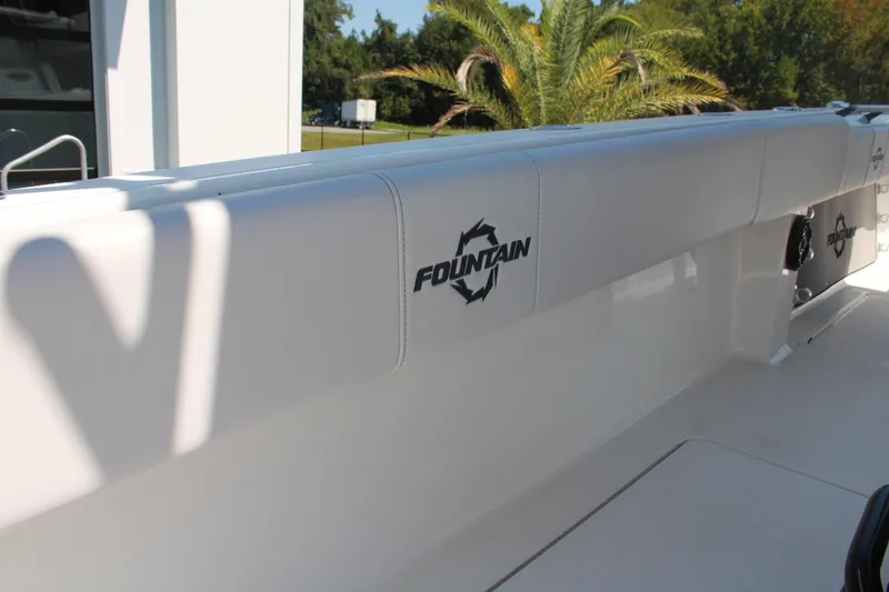 Slide: The Image of 2023 Fountain 34 CC boat interior with logo, featuring sleek white design. - 45