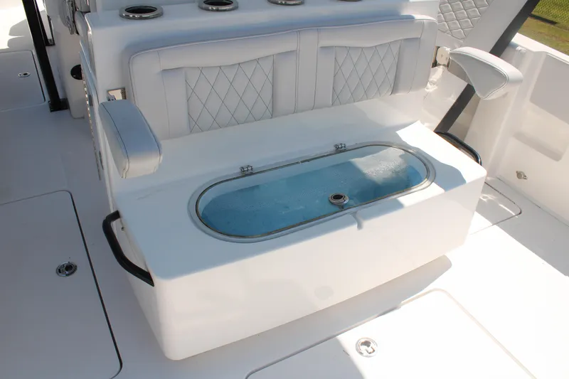 Slide: The Image of 2023 Fountain 34 CC boat seating with built-in livewell and armrests. - 46