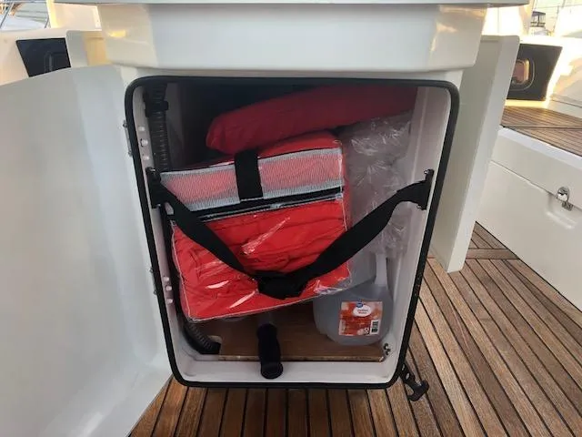 Slide: The Image of Storage compartment on 2023 Beneteau Oceanis 46.1 yacht with safety equipment and supplies. - 22