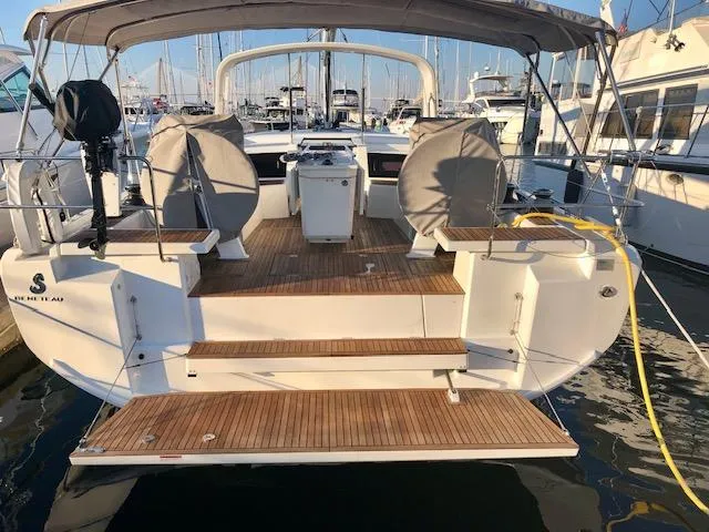 Slide: The Image of 2023 Beneteau Oceanis 46.1 yacht docked, showcasing spacious deck and modern design. - 3