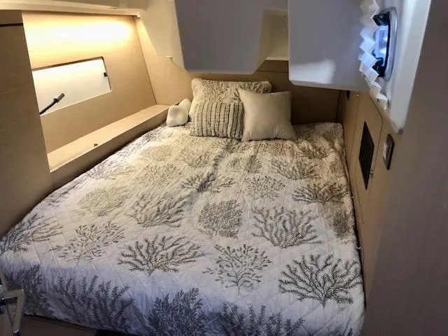 Slide: The Image of Luxurious cabin interior of 2023 Beneteau Oceanis 46.1 yacht with cozy bedding. - 30