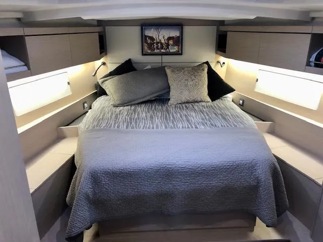 Slide: The Image of Luxurious cabin interior of 2023 Beneteau Oceanis 46.1 yacht with cozy bedding. - 45