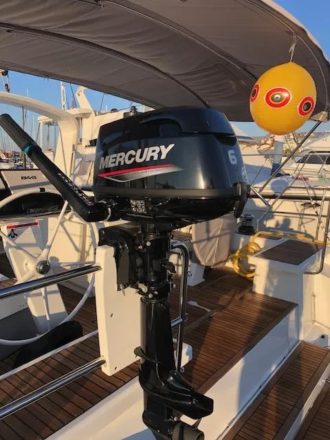 Slide: The Image of Mercury outboard motor on 2023 Beneteau Oceanis 46.1 yacht deck, with yellow buoy. - 5