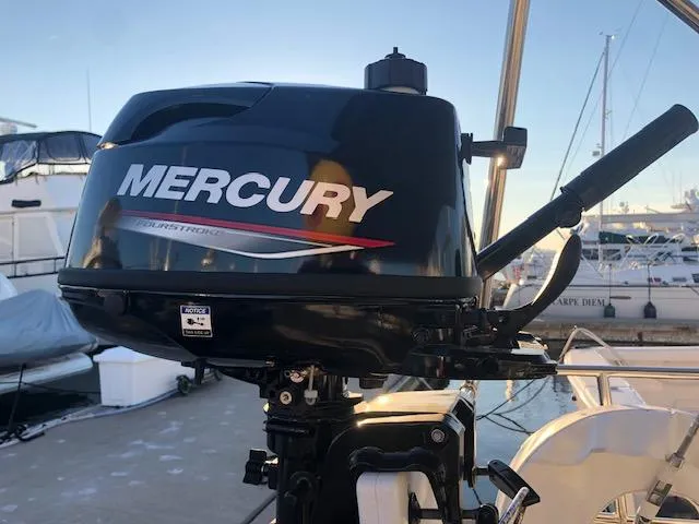 Slide: The Image of Mercury outboard motor on a 2023 Beneteau Oceanis 46.1 yacht at a marina. - 6